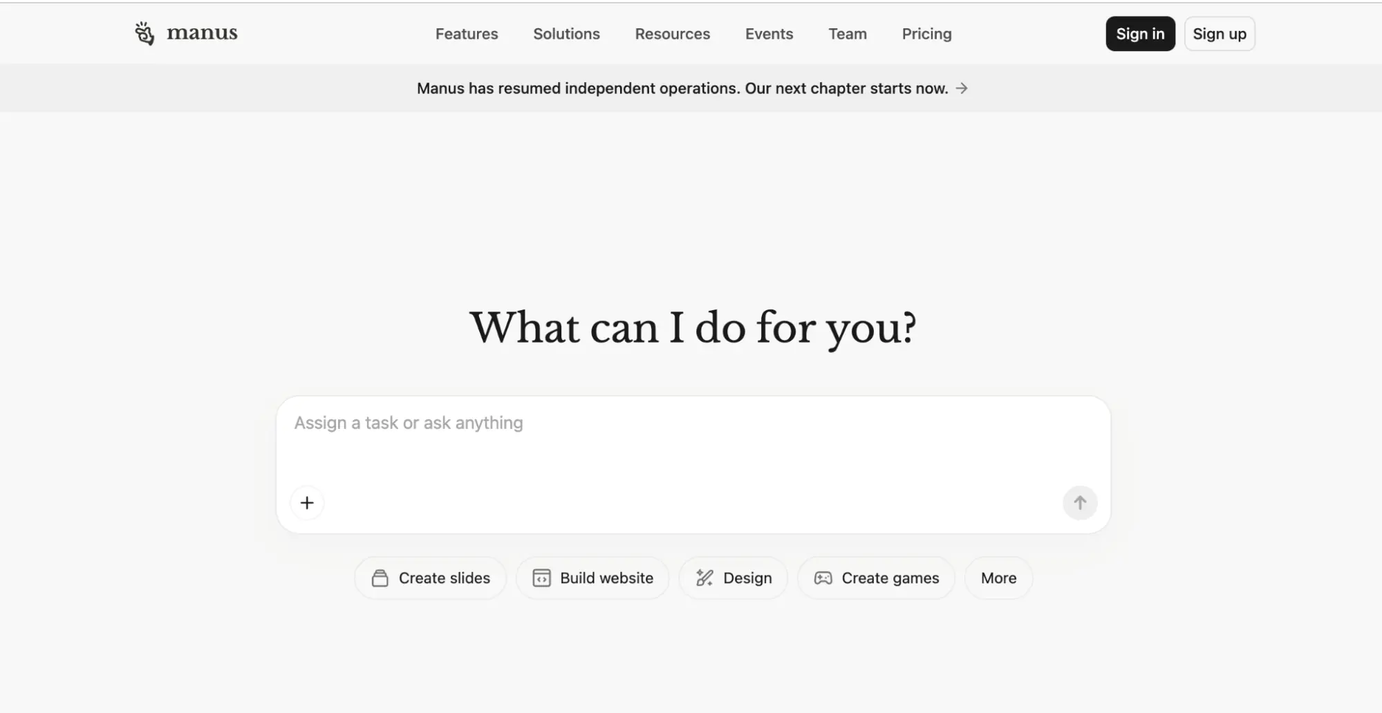 Manus homepage showing the task input box with options to create slides, build a website, or design